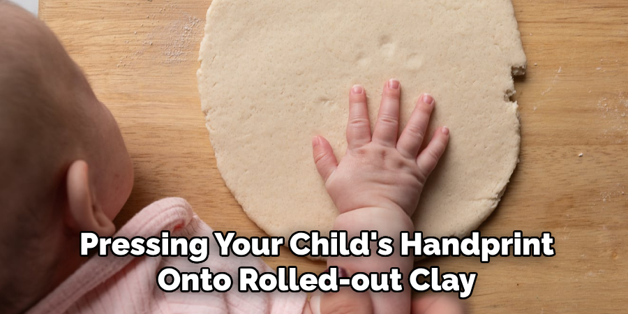 Pressing Your Child's Handprint
Onto Rolled-out Clay