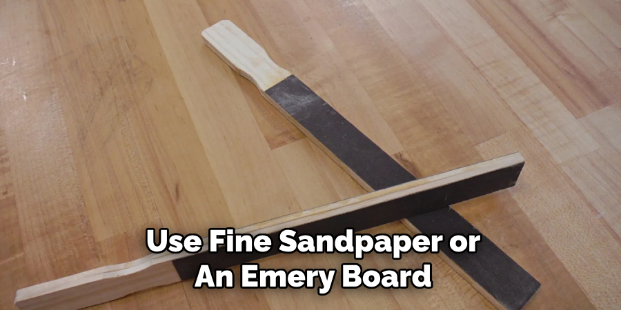 Use Fine Sandpaper or
An Emery Board