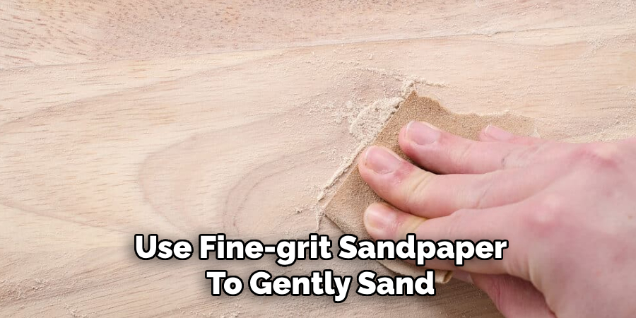 Use Fine-grit Sandpaper
To Gently Sand