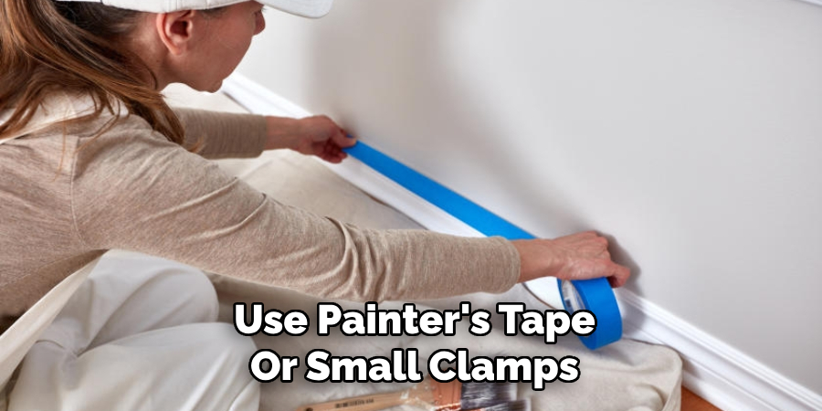 Use Painter's Tape
Or Small Clamps