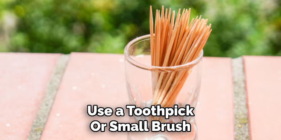 Use a Toothpick
Or Small Brush