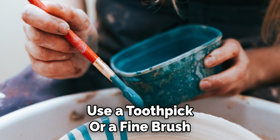 Use a Toothpick
Or a Fine Brush