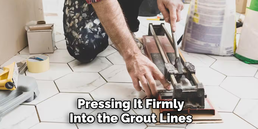 Pressing It Firmly
Into the Grout Lines