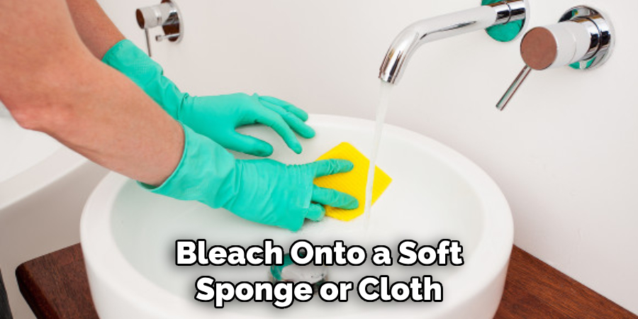 Bleach Onto a Soft Sponge or Cloth