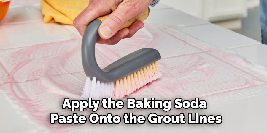 Generously Apply the Baking Soda Paste Onto the Grout Lines