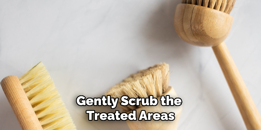  gently scrub the treated areas