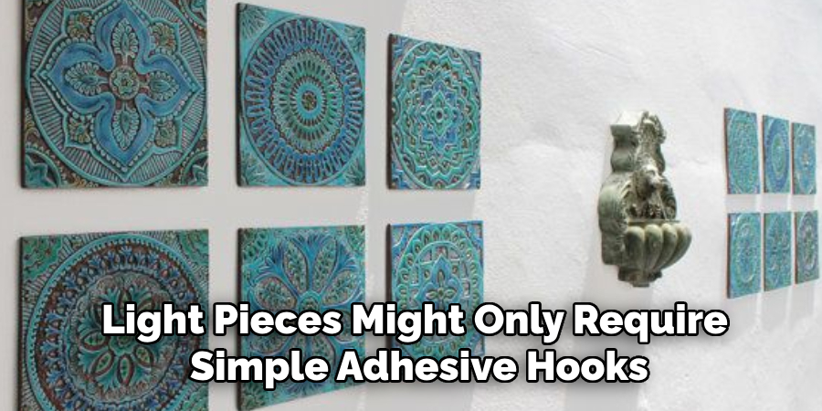 Light pieces might only require simple adhesive hooks