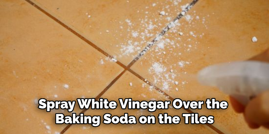 Spray White Vinegar Over the Baking Soda on the Tiles