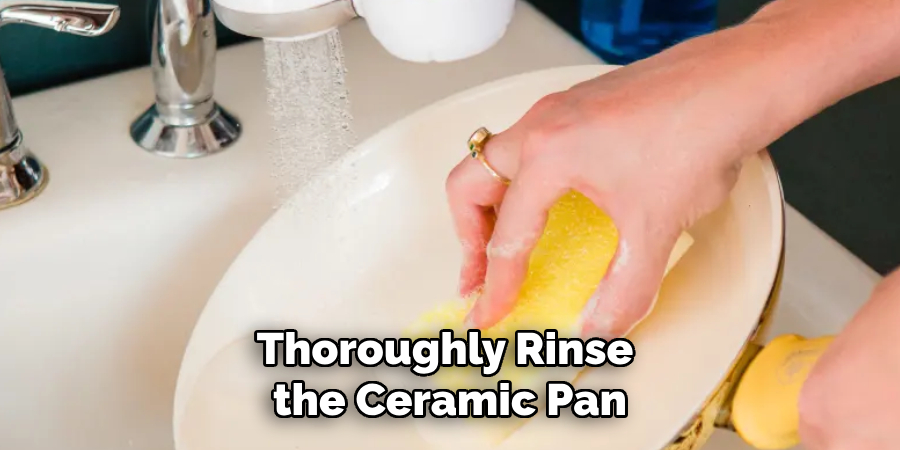 Thoroughly Rinse the Ceramic Pan Under Warm Running Water