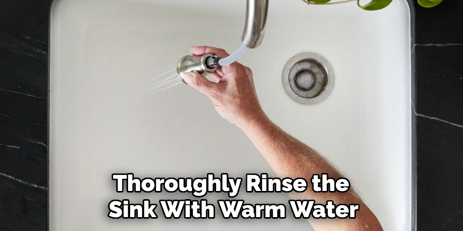 Thoroughly Rinse the Sink With Warm Water