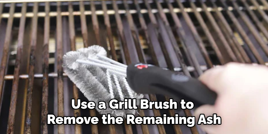 Use a Grill Brush to Remove the Remaining Ash