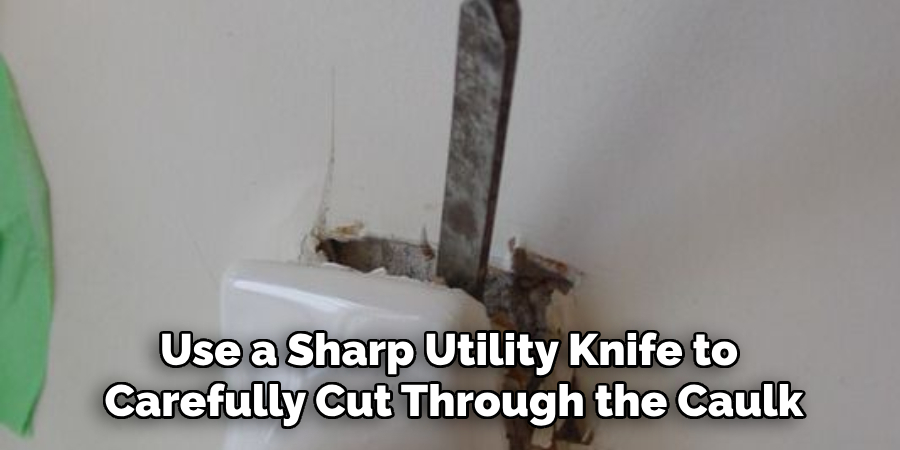 Use a Sharp Utility Knife to Carefully Cut Through the Caulk