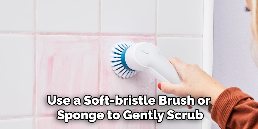 Use a Soft-bristle Brush or Sponge to Gently Scrub the Tiles