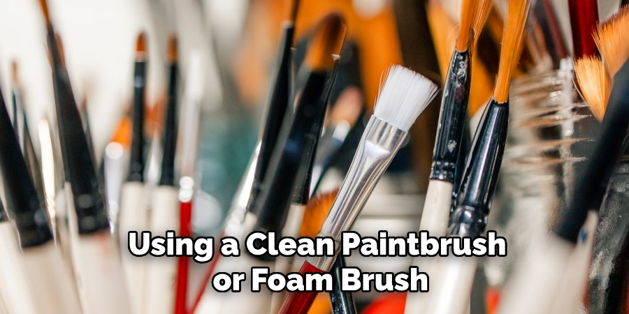 Using a Clean Paintbrush or Foam Brush