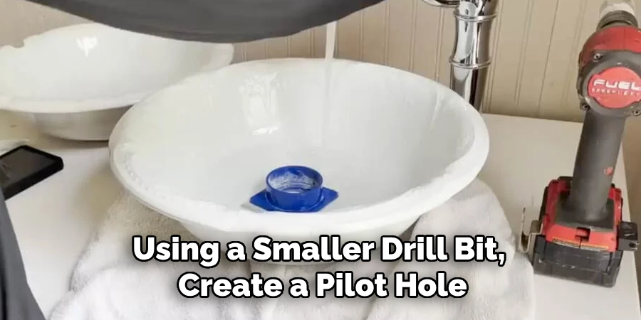 Using a Smaller Drill Bit, Create a Pilot Hole