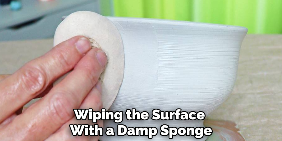 Wiping the Surface With a Damp Sponge